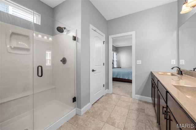 137 Countryshire Dr, Lake St Louis, MO 63367 - ensuite bathroom with baseboards, a shower stall, double vanity, and tile patterned floors