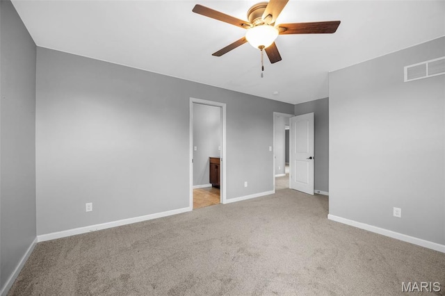 137 Countryshire Dr, Lake St Louis, MO 63367 - unfurnished bedroom with carpet, baseboards, connected bathroom, and ceiling fan