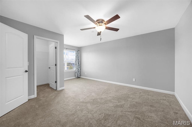137 Countryshire Dr, Lake St Louis, MO 63367 - unfurnished bedroom with a spacious closet, carpet floors, and baseboards