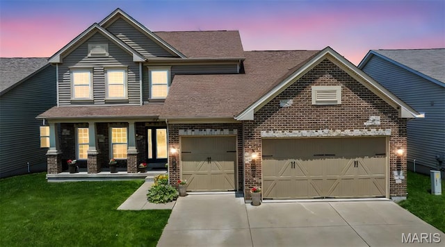 137 Countryshire Dr, Lake St Louis, MO 63367 - view of front of home featuring brick siding, a garage, driveway, a front lawn, and covered porch