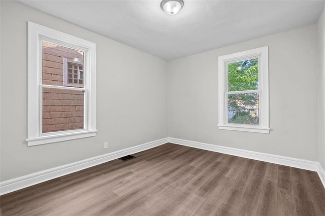 5039 Grace Ave, Saint Louis, MO 63116 - unfurnished room with wood finished floors and baseboards