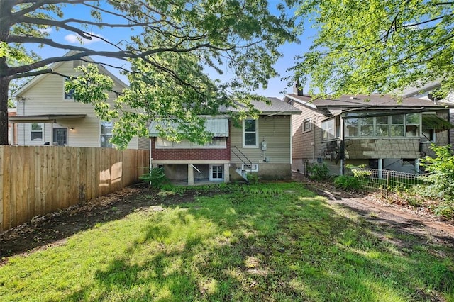 5039 Grace Ave, Saint Louis, MO 63116 - rear view of property featuring a sunroom