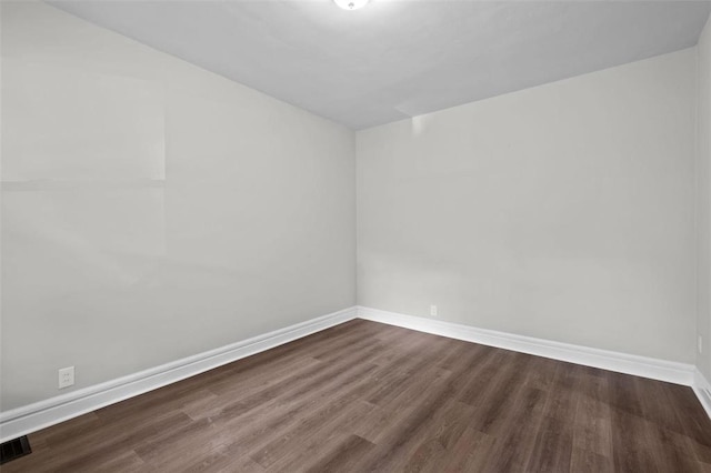 5039 Grace Ave, Saint Louis, MO 63116 - spare room with dark wood-style floors and baseboards
