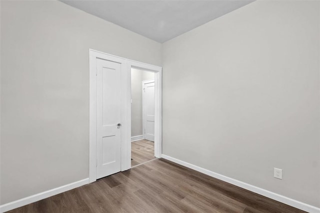 5039 Grace Ave, Saint Louis, MO 63116 - empty room featuring baseboards and wood finished floors