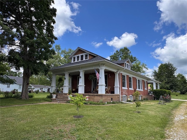 339 E Reynolds St E, Ironton, MO 63650 - neoclassical home featuring covered porch, brick siding, and a front lawn