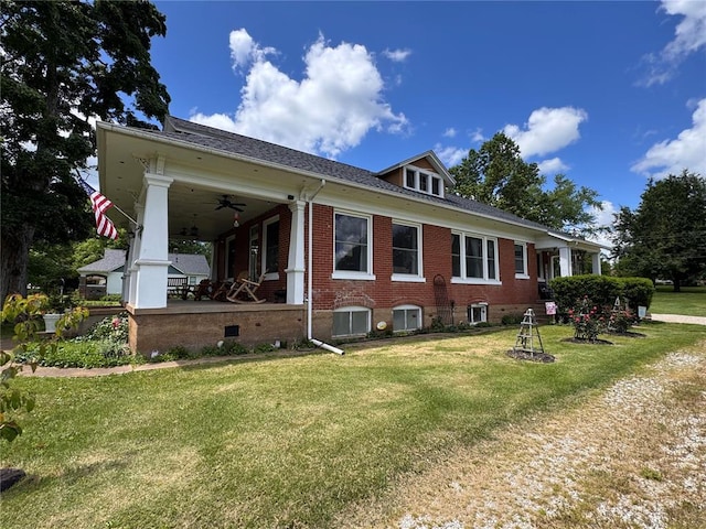 339 E Reynolds St E, Ironton, MO 63650 - view of property exterior with a lawn, ceiling fan, and brick siding