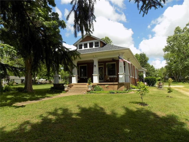 339 E Reynolds St E, Ironton, MO 63650 - view of front of house featuring a porch, a shingled roof, and a front lawn