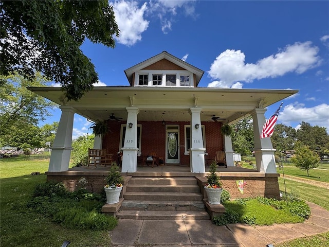 339 E Reynolds St E, Ironton, MO 63650 - view of front of property featuring covered porch, a ceiling fan, brick siding, and a front lawn