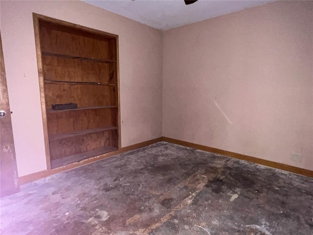 880 W Nicholas St, Carlinville, IL 62626 - spare room featuring unfinished concrete flooring and baseboards