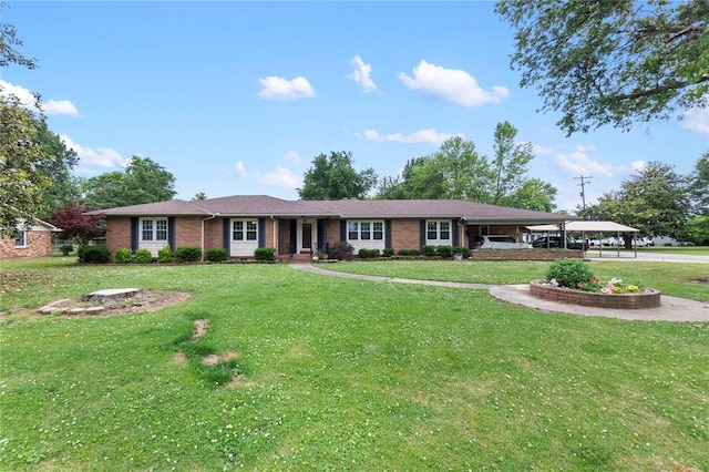 102 E Charlotte, Lilbourn, MO 63862 - ranch-style house featuring brick siding and a front lawn