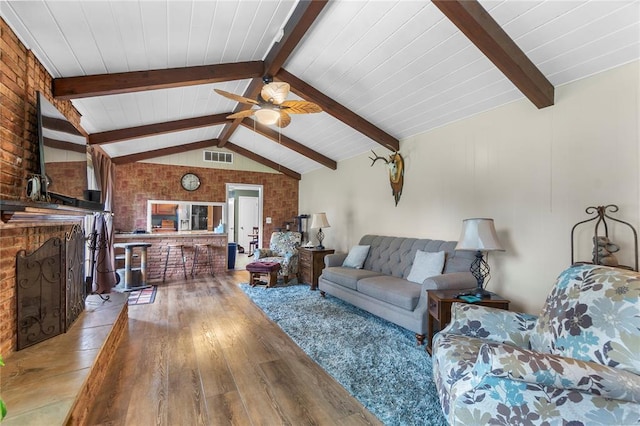 102 E Charlotte, Lilbourn, MO 63862 - living area with brick wall, light wood finished floors, and ceiling fan