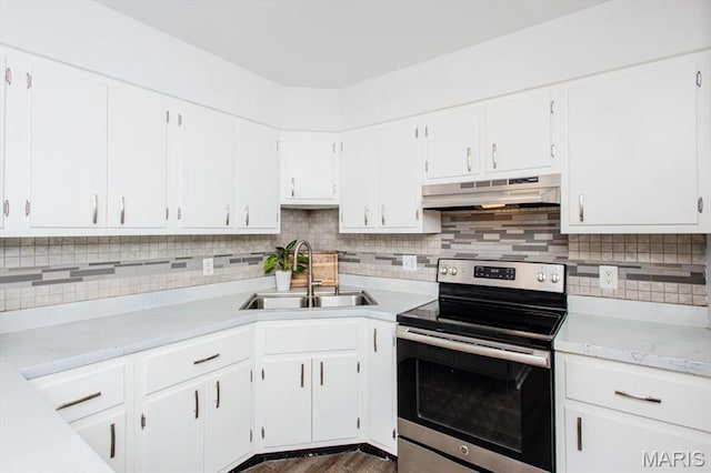 10077 N Bunker Hill Dr Unit F, Mehlville, MO 63123 - kitchen with stainless steel electric range, under cabinet range hood, white cabinetry, and decorative backsplash