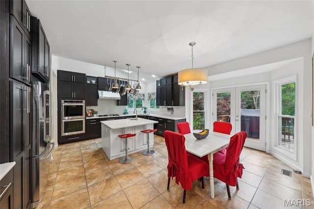 200 Hibler Oaks Dr, Creve Coeur, MO 63141 - dining area with plenty of natural light, french doors, and a chandelier