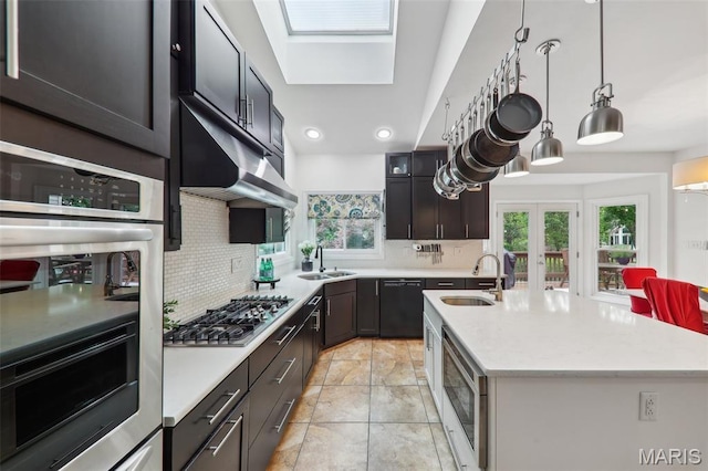 200 Hibler Oaks Dr, Creve Coeur, MO 63141 - kitchen featuring a sink, stainless steel appliances, decorative backsplash, an island with sink, and recessed lighting