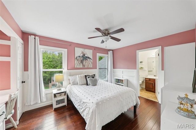 200 Hibler Oaks Dr, Creve Coeur, MO 63141 - bedroom featuring dark wood-type flooring, a wainscoted wall, ensuite bath, ceiling fan, and a decorative wall