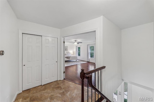 200 Hibler Oaks Dr, Creve Coeur, MO 63141 - hallway with an upstairs landing, stone finish floors, and baseboards