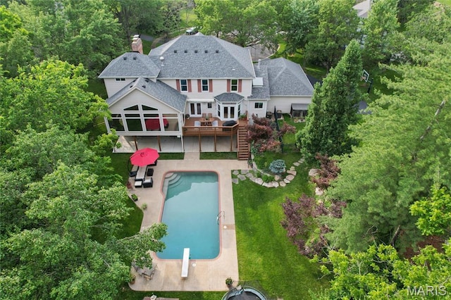 200 Hibler Oaks Dr, Creve Coeur, MO 63141 - back of property with stairway, a wooden deck, a lawn, a patio, and an outdoor pool
