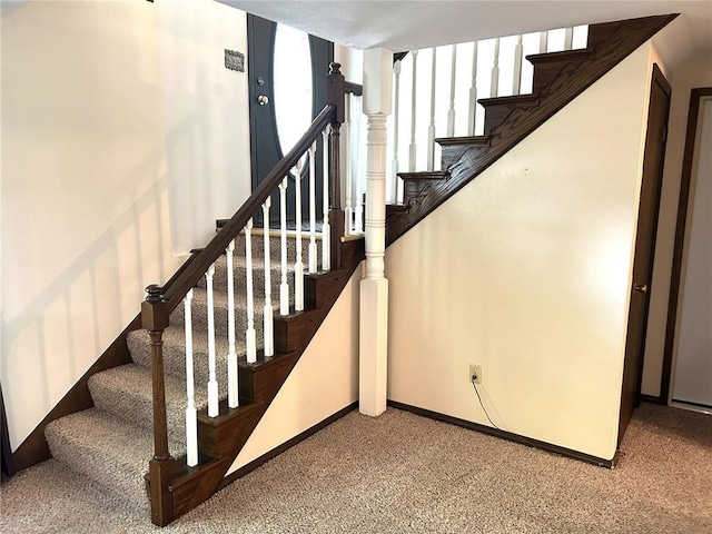 staircase with carpet flooring and baseboards