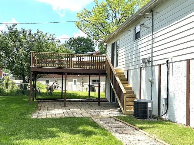 wooden terrace featuring stairway, a patio, and central air condition unit