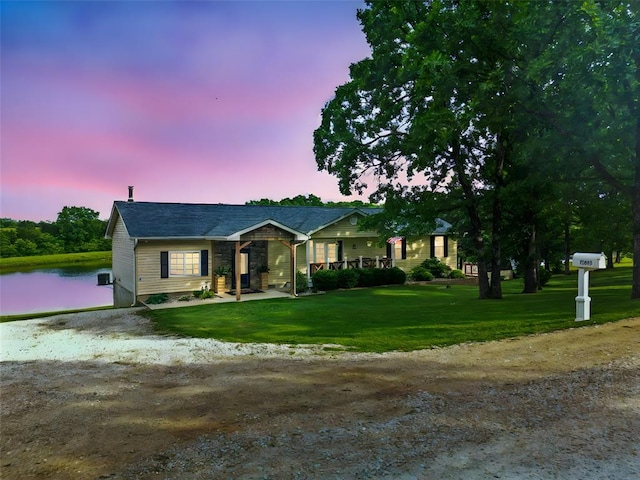 12930 Mohawk Dr, De Soto, MO 63020 - ranch-style house with a yard and a water view