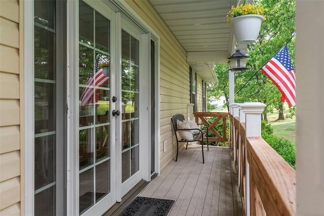 12930 Mohawk Dr, De Soto, MO 63020 - wooden porch with french doors