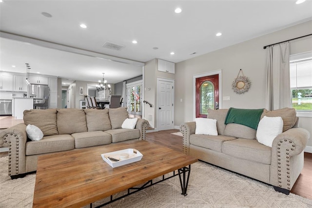 12930 Mohawk Dr, De Soto, MO 63020 - living room with a chandelier, recessed lighting, light wood finished floors, and baseboards