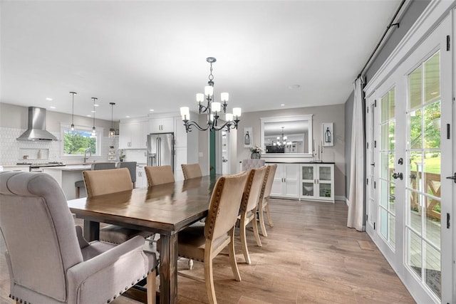 12930 Mohawk Dr, De Soto, MO 63020 - dining area with a chandelier, light wood-style floors, and recessed lighting