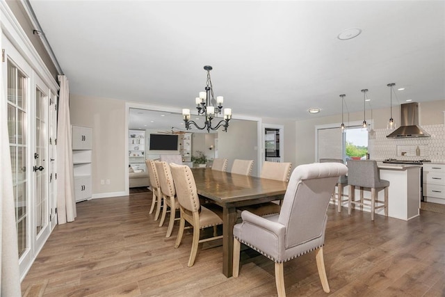 12930 Mohawk Dr, De Soto, MO 63020 - dining room with a chandelier, light wood-type flooring, french doors, and recessed lighting