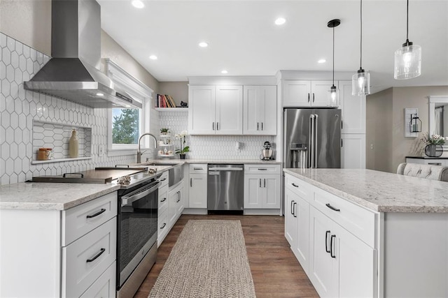 12930 Mohawk Dr, De Soto, MO 63020 - kitchen featuring appliances with stainless steel finishes, wall chimney range hood, open shelves, a sink, and backsplash