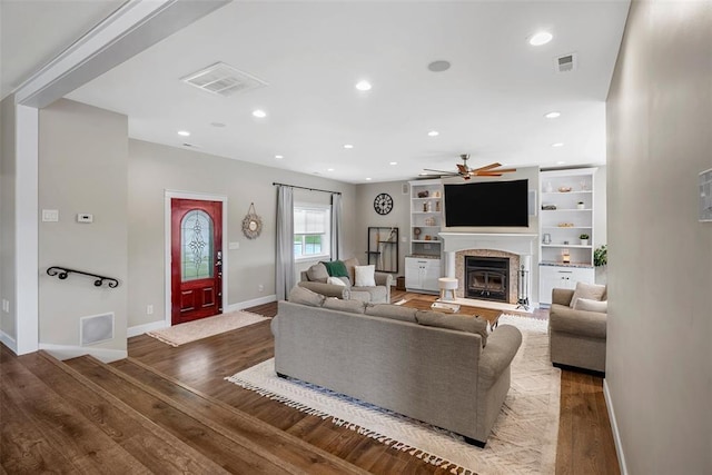 12930 Mohawk Dr, De Soto, MO 63020 - living room with a ceiling fan, wood finished floors, a fireplace, baseboards, and recessed lighting