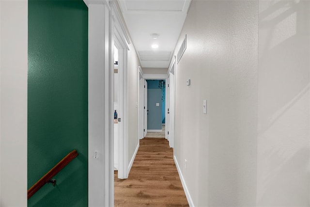 12930 Mohawk Dr, De Soto, MO 63020 - hallway with light wood finished floors, baseboards, and attic access