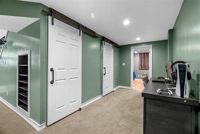 12930 Mohawk Dr, De Soto, MO 63020 - office with a barn door, light colored carpet, baseboards, and recessed lighting