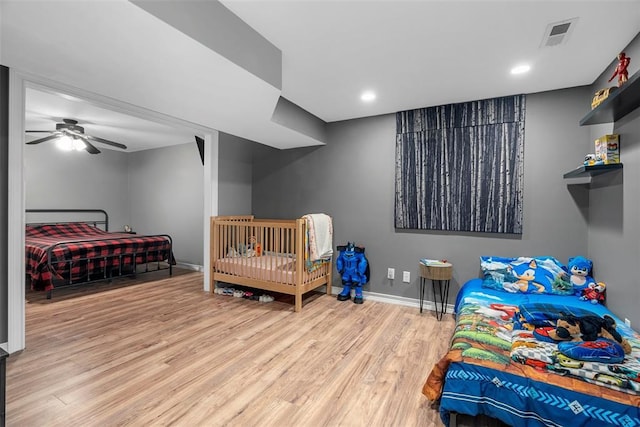 12930 Mohawk Dr, De Soto, MO 63020 - bedroom with wood finished floors, baseboards, and recessed lighting