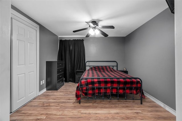 12930 Mohawk Dr, De Soto, MO 63020 - bedroom with wood finished floors, baseboards, and ceiling fan