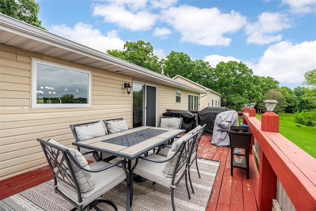 12930 Mohawk Dr, De Soto, MO 63020 - wooden deck featuring outdoor dining area and grilling area