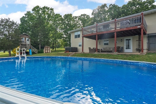 12930 Mohawk Dr, De Soto, MO 63020 - outdoor pool featuring outdoor lounge area, a deck, a lawn, and a patio area