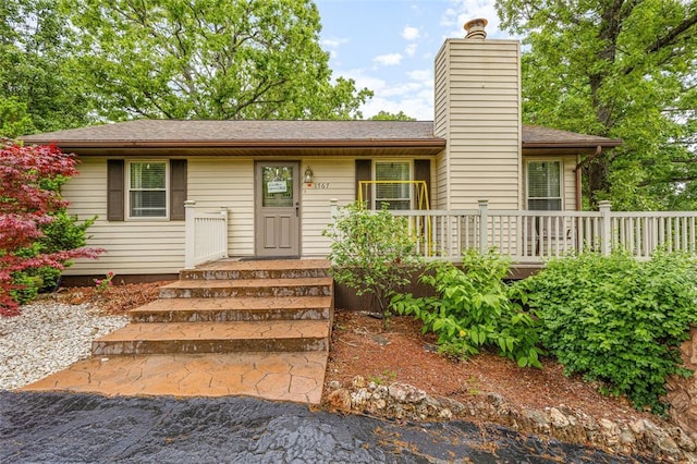 1767 Rue Andre, Bonne Terre, MO 63628 - ranch-style home featuring a chimney and a wooden deck