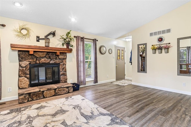1767 Rue Andre, Bonne Terre, MO 63628 - living room with wood finished floors, vaulted ceiling, baseboards, and a fireplace