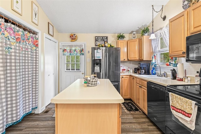 1767 Rue Andre, Bonne Terre, MO 63628 - kitchen featuring black appliances, a sink, plenty of natural light, dark wood-style floors, and a textured ceiling