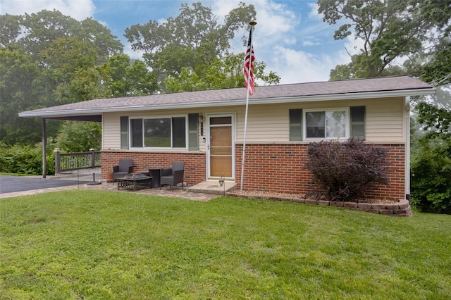 6413 Randy Dr, Imperial, MO 63052 - view of front facade featuring brick siding and a front yard