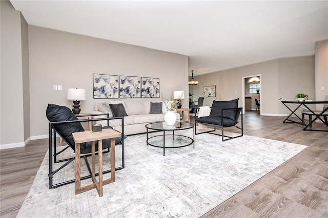 living room featuring wood finished floors and baseboards