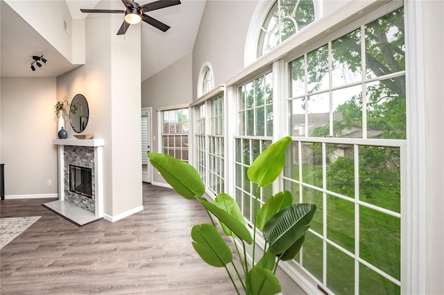 sunroom / solarium featuring vaulted ceiling