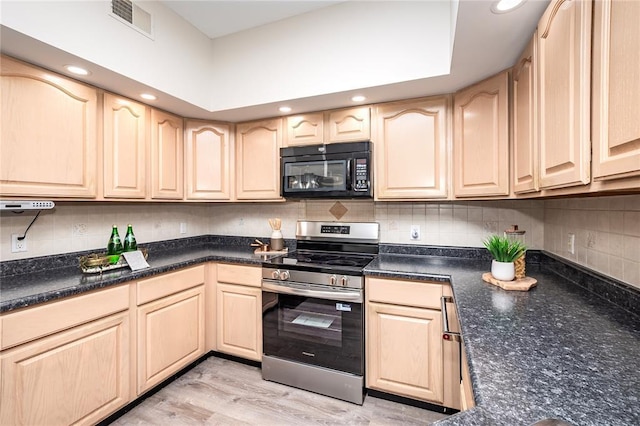 kitchen featuring black microwave, stainless steel electric range oven, light brown cabinetry, and recessed lighting