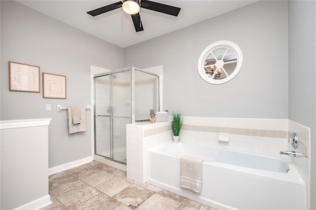 full bath with a ceiling fan, a stall shower, a garden tub, and baseboards