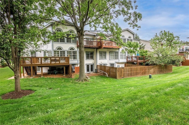 rear view of house with a deck and stairway