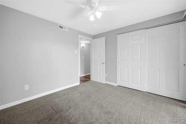 11 Fairways Cir Unit A, Saint Charles, MO 63303 - unfurnished bedroom featuring carpet flooring, baseboards, a closet, and a ceiling fan