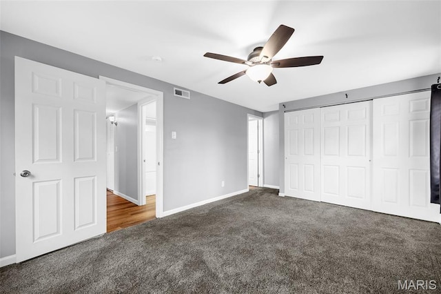 11 Fairways Cir Unit A, Saint Charles, MO 63303 - unfurnished bedroom with carpet floors, baseboards, a closet, and a ceiling fan