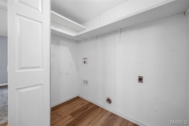 11 Fairways Cir Unit A, Saint Charles, MO 63303 - washroom with electric dryer hookup, washer hookup, wood finished floors, baseboards, and attic access