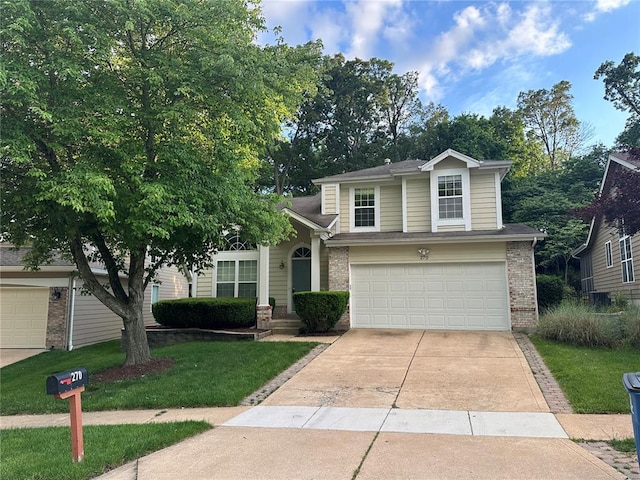 270 Cove Landing Dr, Wildwood, MO 63040 - view of front of property featuring brick siding, concrete driveway, a front lawn, and an attached garage