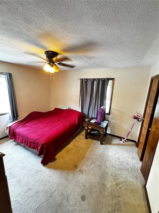 308 N Ellen St, Dixon, MO 65459 - carpeted bedroom with a textured ceiling and a ceiling fan